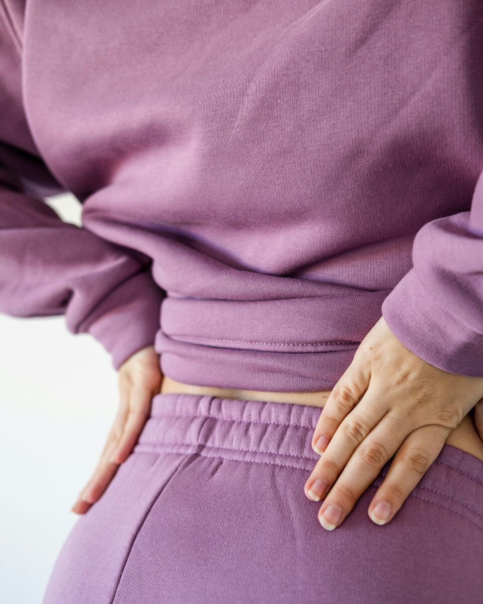 Primary Care Abdominal Pain: Causes, Evaluation, and When to Seek Care 7 Person holding side with abdominal pain in Fairfax