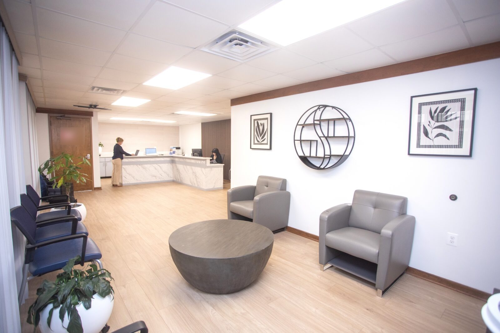 Waiting area and reception desk at Norvinia Health, providing direct primary care for employers and individuals in Fairfax, VA